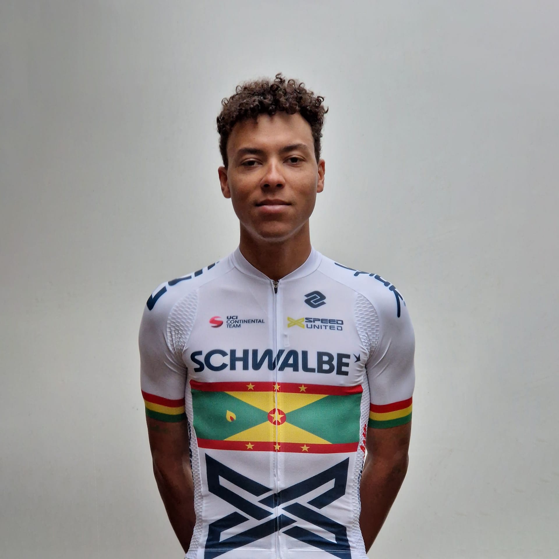Red Walters in X Speed United cycling kit with Grenada flag